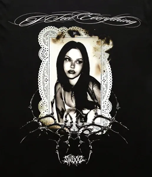 Front print: a burnt lace frame around a sepia portrait, chrome tribal closing beneath it