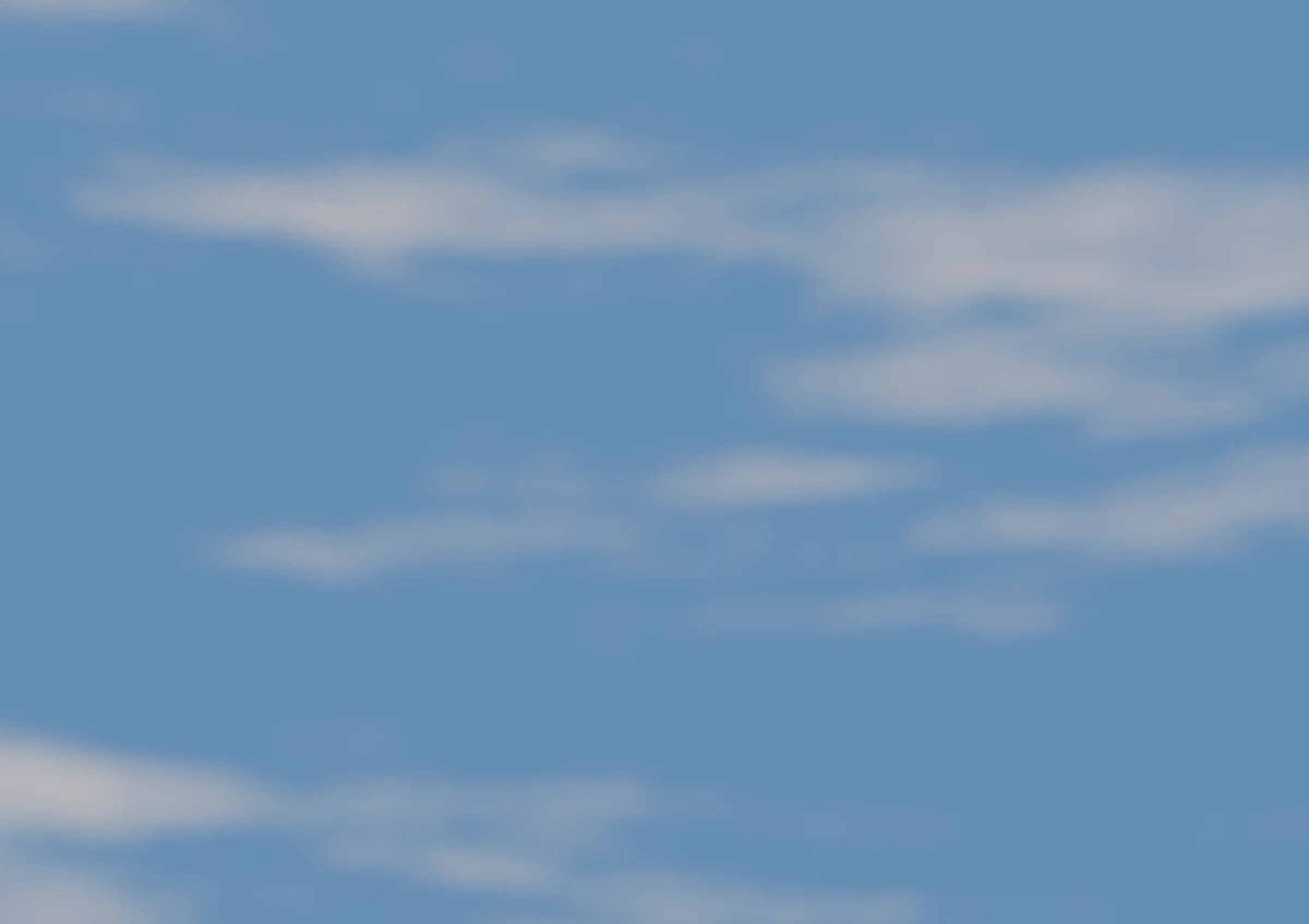 A clear summer sky with soft clouds