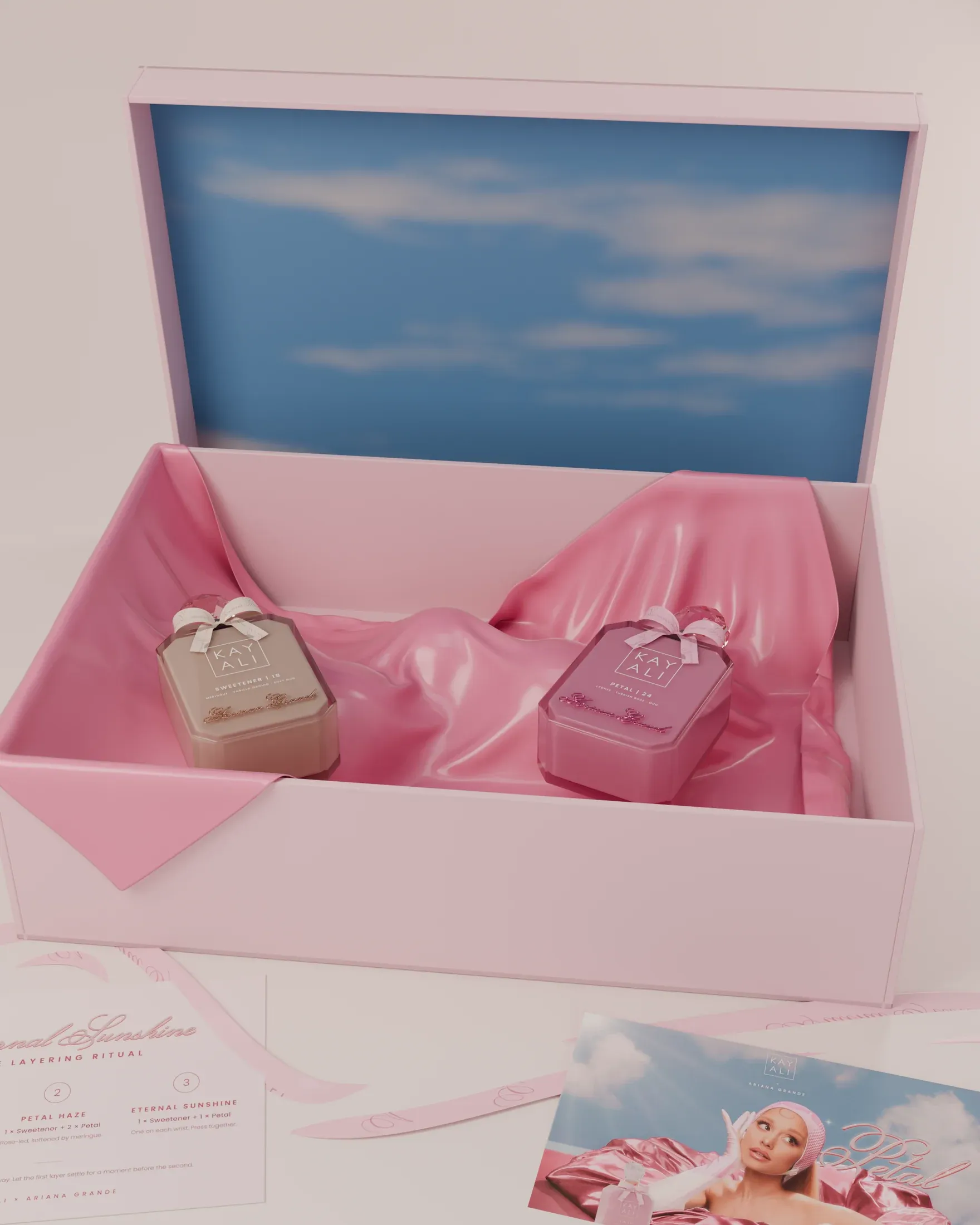 The PR box, open: a sky under the lid, both flacons on satin