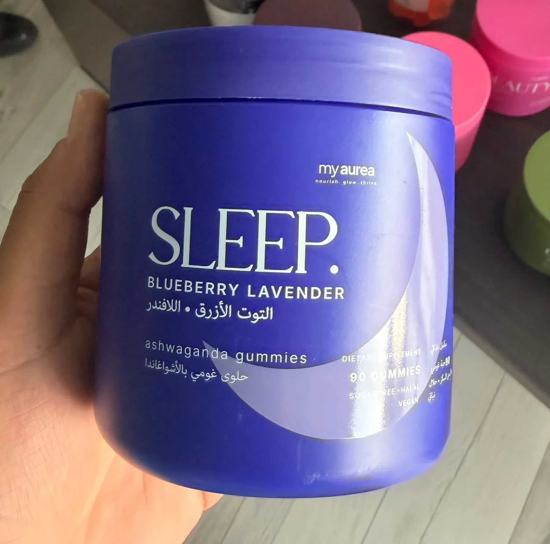 The finished my sleep jar, violet, held in a hand