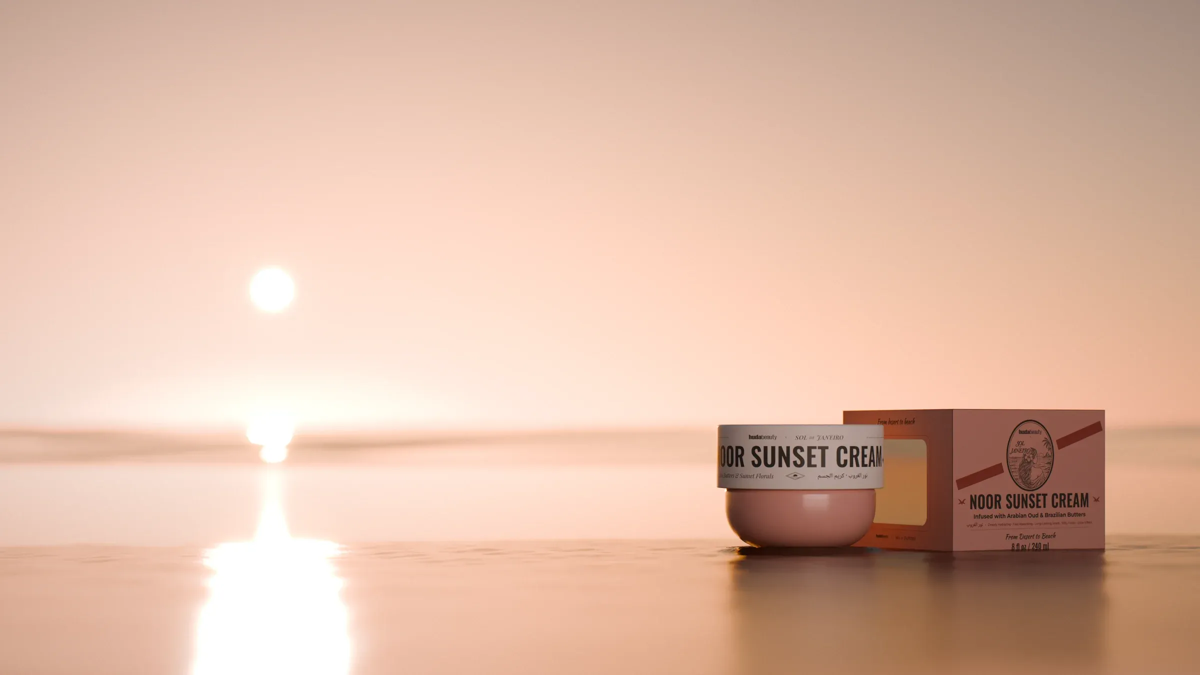 The same camera at the beach: Noor Sunset and its carton in the wet sand