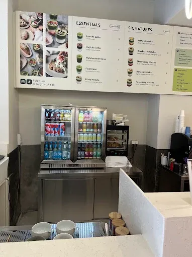 Printed menu board above the counter fridges