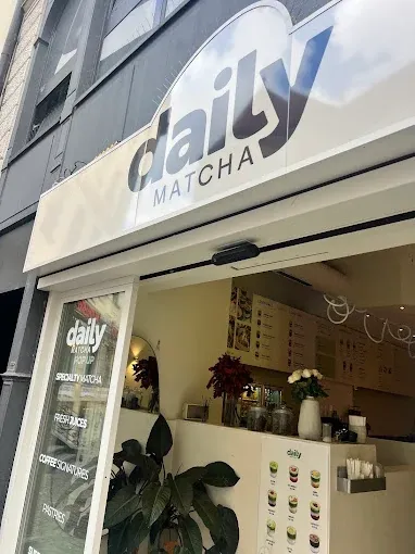 Window graphic reading serving happiness seven days a week